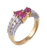 A ruby and diamond ring, the three pear cut rubies claw set between brilliant cut and baguette cut