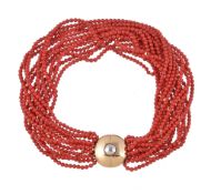 Ω A multi strand coral necklace , the uniform coral beads measuring 4.4mm, to a circular two colour