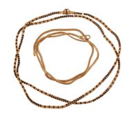 A gold coloured chevron link necklace, to a S shaped clasp stamped 916, 45cm long, 9.9g; together