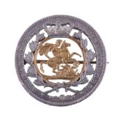 A Victorian coin brooch, the pierced silver coin centred with a pierced sovereign, 3.8cm diameter