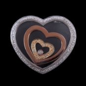 A diamond heart pendant, the three hearts with a glazed panels, accented with brilliant cut