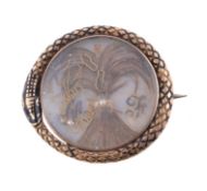 A mid 19th century hairwork and enamel brooch, circa 1840, the wheatsheaf of hair between the