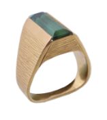 A 1970s green tourmaline ring, the rectangular cut green tourmaline within a textured surround,