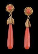 Ω A pair of mid 19th century coral earrings, circa 1850, the polished coral drops with engraved