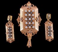 A French early 20th century locket and ear pendants, the rectangular locket with scrolled foliate