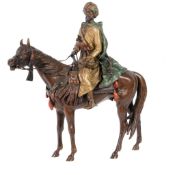 A Viennese cold painted bronze equestrian group of an Arab horseman, by Bergman, early 20th