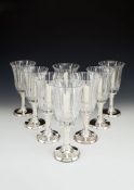 Asprey, a set of eight glass and silver mounted candle holders by Asprey, import mark for London