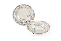 Asprey, a pair of silver circular pierced dishes by Asprey, 1989 and 1991, chased, pierced and