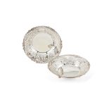 Asprey, a pair of silver circular pierced dishes by Asprey, 1989 and 1991, chased, pierced and