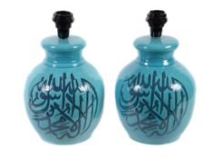 A pair of blue glazed ceramic table lamps, loosely in Iznic taste, modern, each with calligraphic