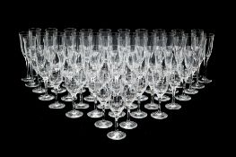 A modern part table service of Atlantis glass, comprising: thirty one champagne; sixteen red wine