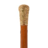 A late 18th century gold and malacca walking stick, circa 1780, the baulister shaped grip with