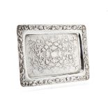 An Edwardian silver oblong tray by Harry Brasted, London 1902, chased with fruit and foliate