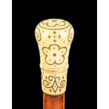 Ω A Queen Anne pique worked ivory mounted malacca walking stick, early 18th century, the knopped