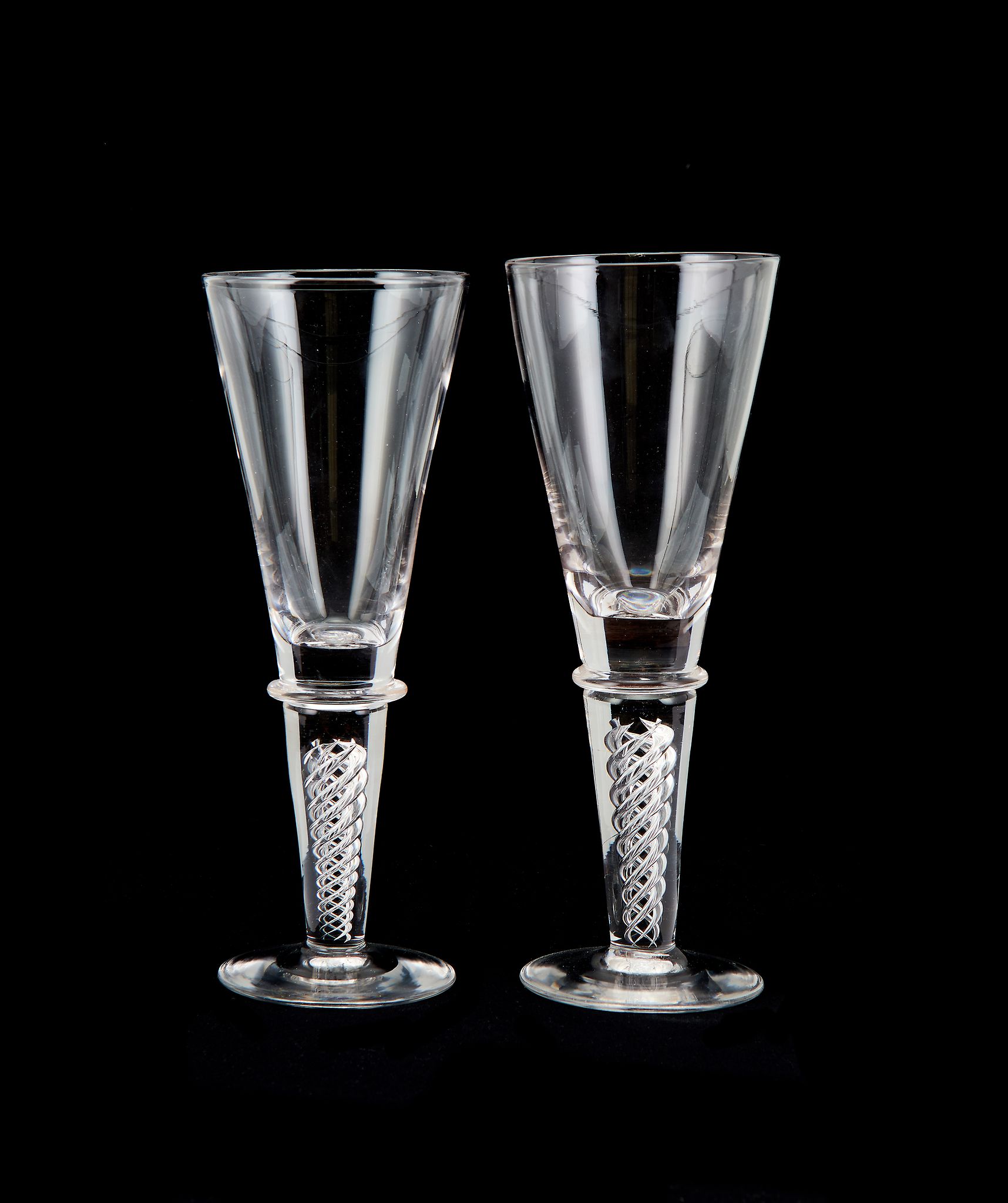 A pair of large modern goblets in eighteenth century style of Whitefriars type, of drawn trumpet