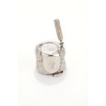 An Edwardian silver novelty mustard pot and spoon by Elkington & Co., London 1910, cast and chased