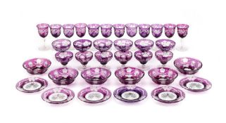 A Czech engraved and amethyst flashed glass part table service, comprising: twelve various wine