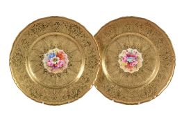 A pair of Royal Worcester plates signed by Freeman and Price , 1950s, painted with panels of