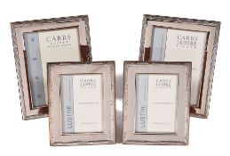 A set of four silver mounted rectangular photo frames by Carrs of Sheffield, Sheffield 2007, with