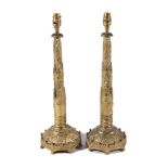 A pair of gilt, repousse worked and cast bronze table lamps, second quarter 19th century and later