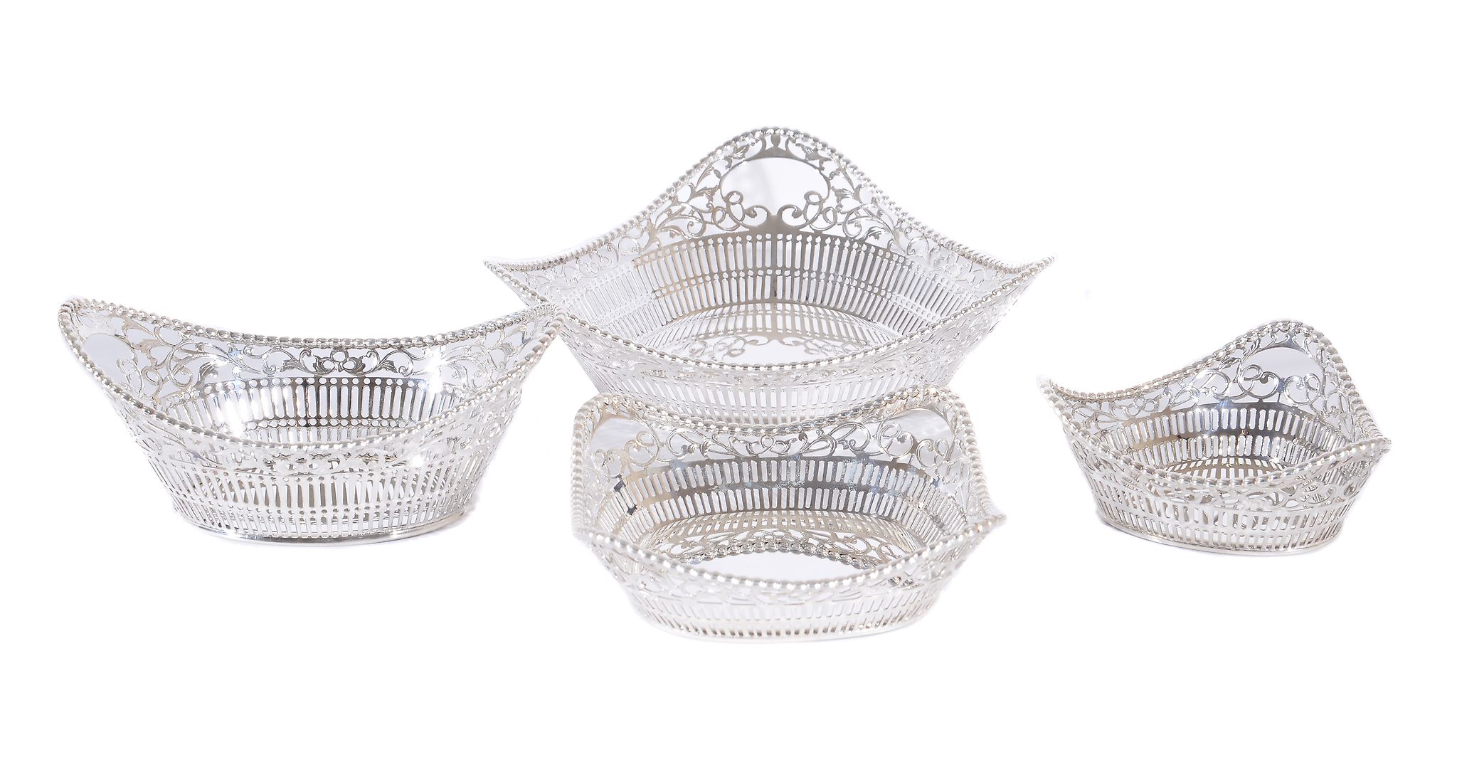 Asprey, four silver pierced baskets by Asprey, import mark for London 1995, with beaded borders,