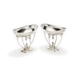 A pair of Edwardian Arts & Crafts style silver tazzae, maker's mark S & C (untraced), London 1906,