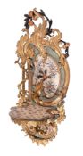 A Louis XV carved, painted and parcel gilt wood wall bracket, circa 1770 and later redecorated