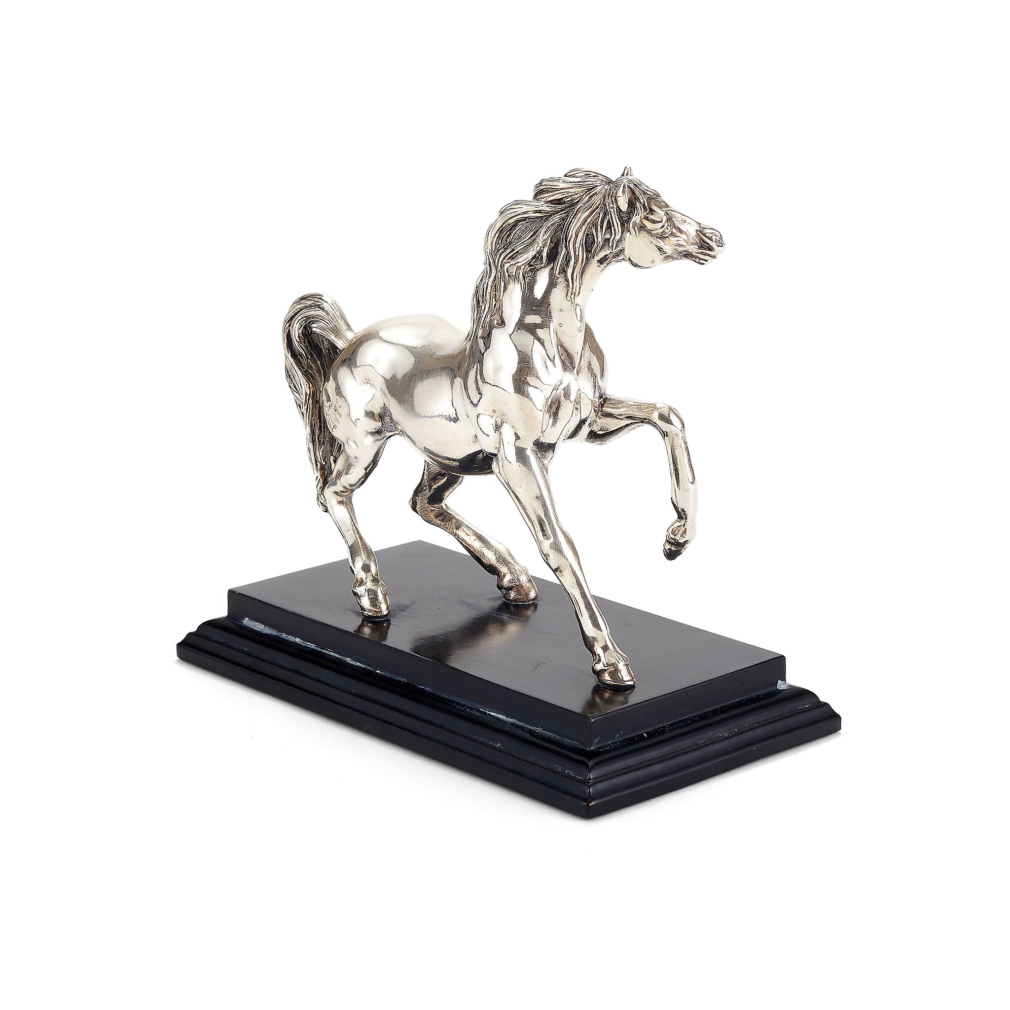 An Italian filled silver model of a horse by Marino, import marked for London 1992, on a black