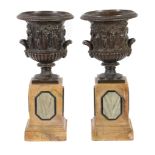 A pair of Continental patinated bronze and marble mounted models of the Borghese Vase, late 19th