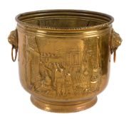 A Dutch repousse worked brass twin handled jardiniere, early 20th century, of cylindrical form, the