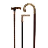 Ω An early 20th century tortoiseshell and gold walking stick , the tortoiseshell grip, with a 9