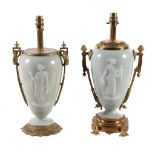 Two similar pÃ¢te-sur-pÃ¢te style porcelain vases gilt metal mounted as table lamps, 20th century,