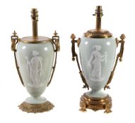 Two similar pÃ¢te-sur-pÃ¢te style porcelain vases gilt metal mounted as table lamps, 20th century,