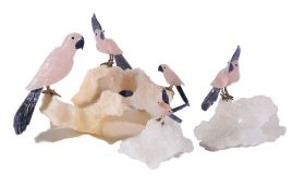 A rose quartz, sodalite and calcite cockatoo group, the polycrystaline calcite base with three