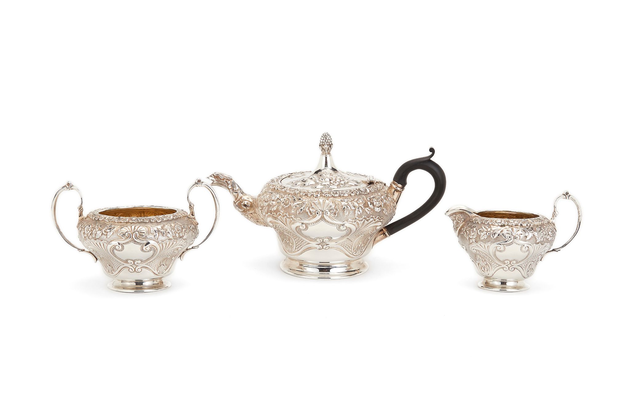 A late Victorian silver bachelor's three piece tea service, mark of Elkington & Co. over-striking