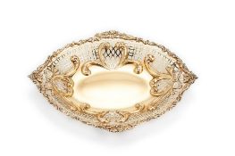 A Victorian silver gilt shaped oval bowl by William Comyns & Sons, London 1890, with a chased