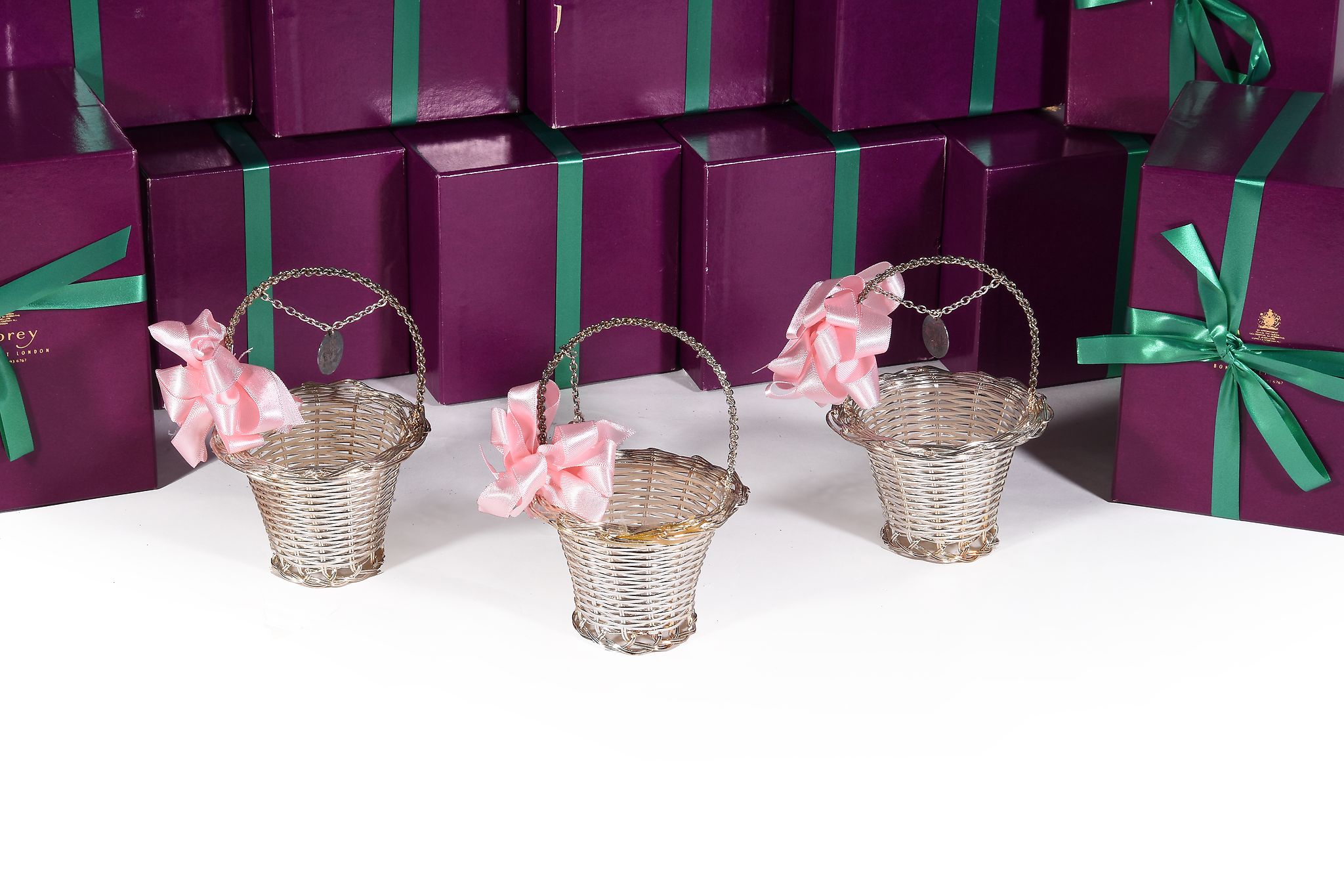 Asprey, twenty electro-plated wedding sweet meat baskets, with loop handles and circular reserves , - Image 2 of 2