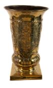 A Dutch repousse worked brass urn, probably an umbrella stand, early 20th century, of urn form with