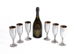 Asprey, a set of six silver champagne flutes by Asprey, London 1984, with turned stems and on