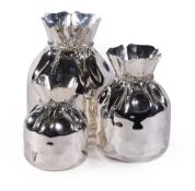 Asprey, three graduated silver plated vases by Almazan, each in the form of an open drawstring bag,