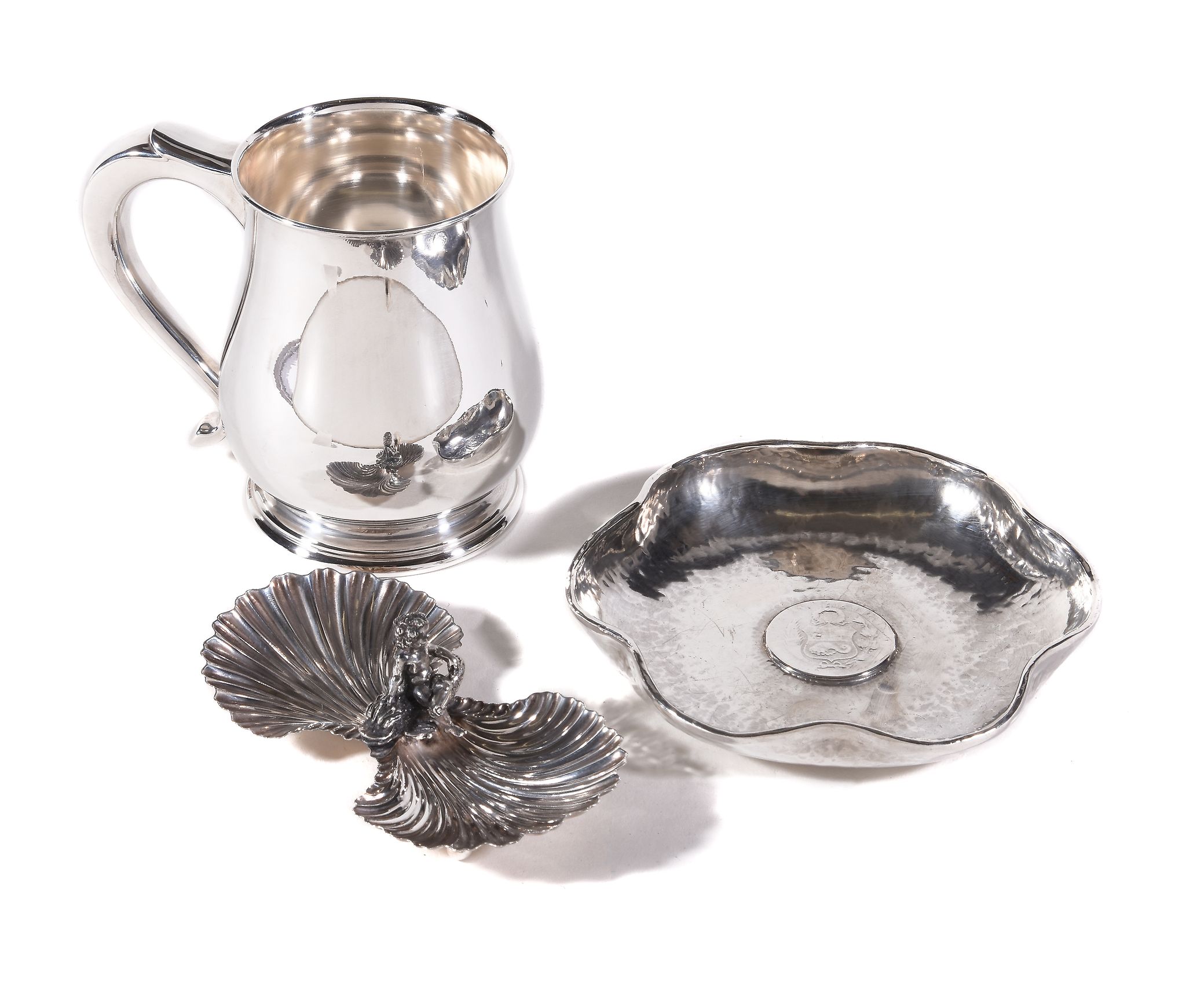 A silver baluster mug by Carr's of Sheffield Ltd., Sheffield 2000, with a scroll handle and on a