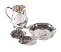 A silver baluster mug by Carr's of Sheffield Ltd., Sheffield 2000, with a scroll handle and on a