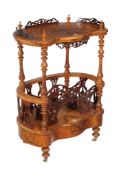 A Victorian burr walnut Canterbury whatnot , circa 1860, of serpentine outline, with a single