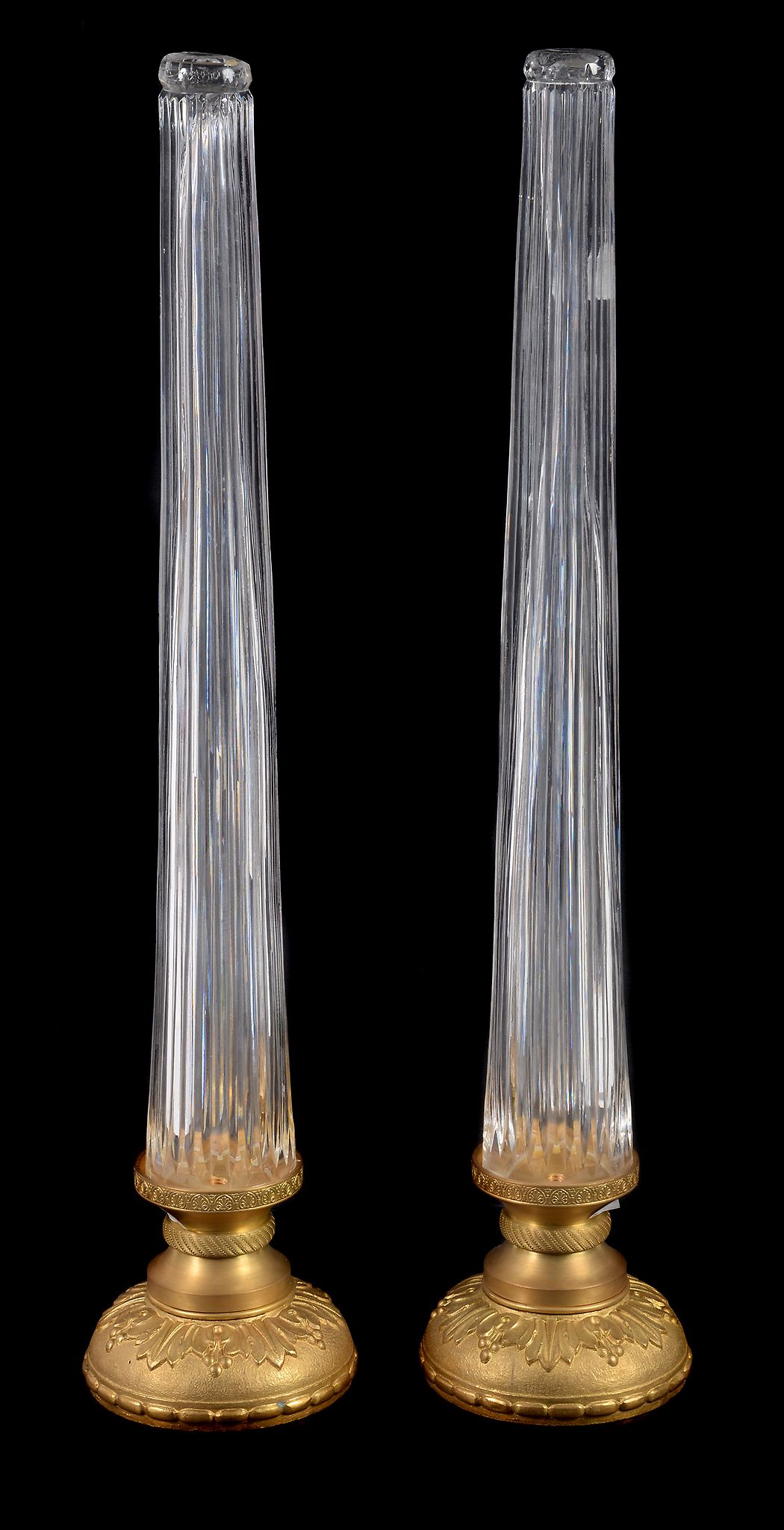 A pair of gilt metal mounted moulded glass lamp bases, second half 20th century, the tapering stems