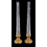 A pair of gilt metal mounted moulded glass lamp bases, second half 20th century, the tapering stems
