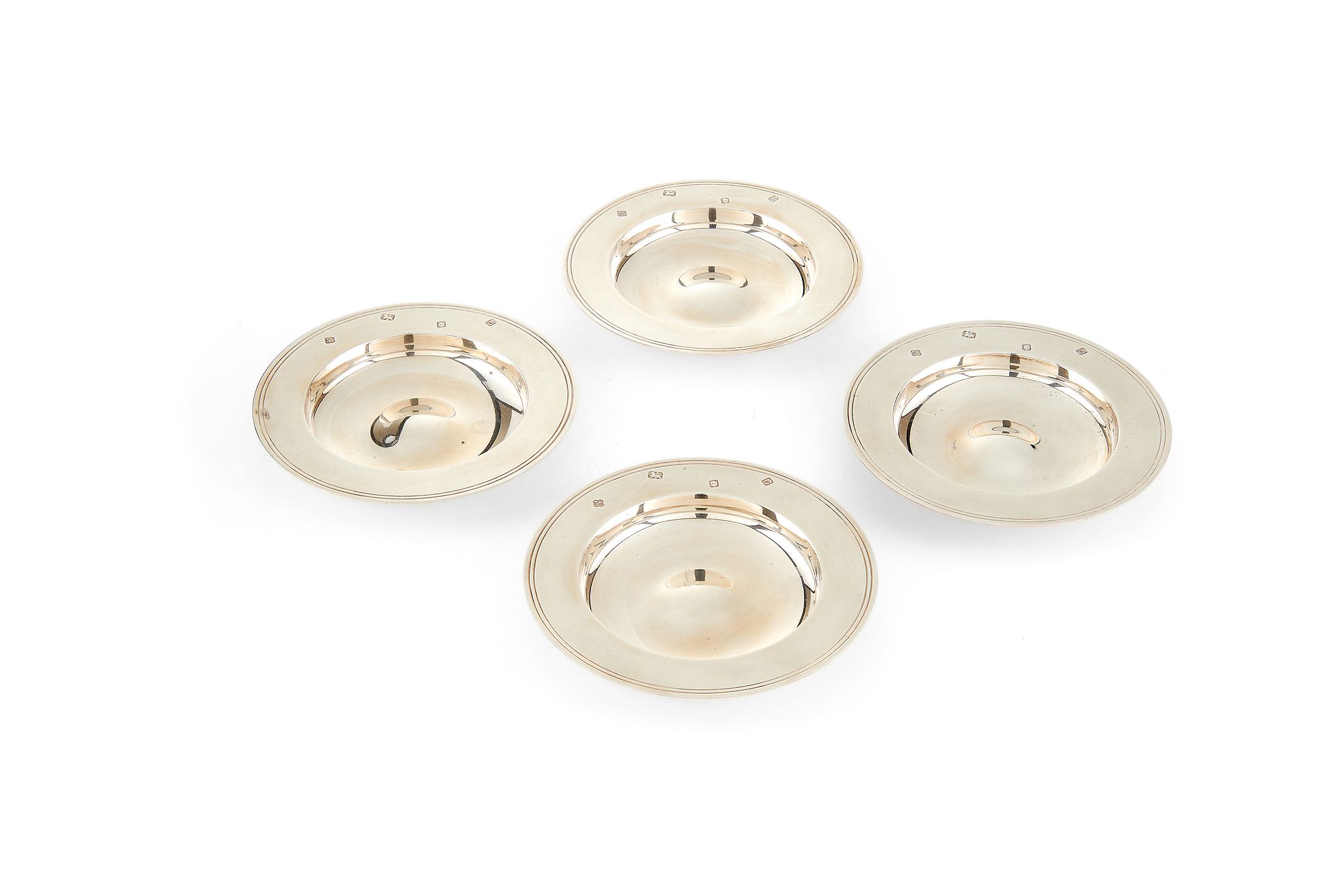 Asprey, a set of four silver circular ashtrays by Asprey, London 1988, with reeded borders, 14.