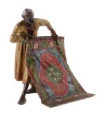 An Viennese cold painted bronze model of a Moorish carpet salesman, early 20th century, by Bergman,