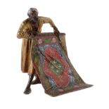 An Viennese cold painted bronze model of a Moorish carpet salesman, early 20th century, by Bergman,