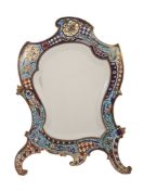 A French brass and champleve enamel dressing table mirror, late 19th century, of cartouche outline,