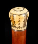 Ω A Queen Anne or George I pique worked ivory mounted malacca walking stick, early 18th century,